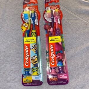 2 value packs of Colgate toothbrushes